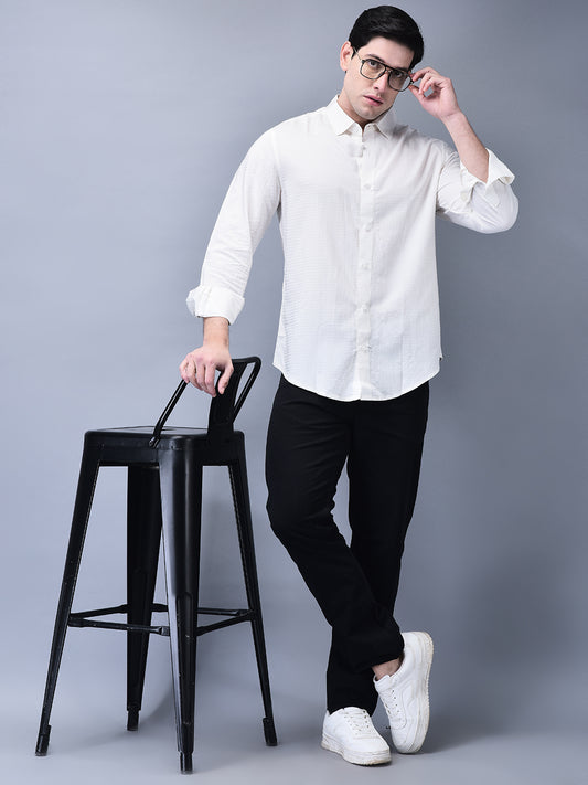 Full body view with model posing near a chair – crisp slim fit white shirt