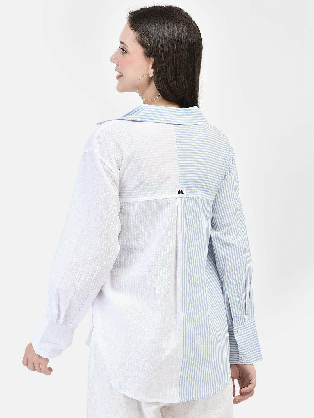 Back view of blue striped cotton shirt – relaxed fit and back pleat visible