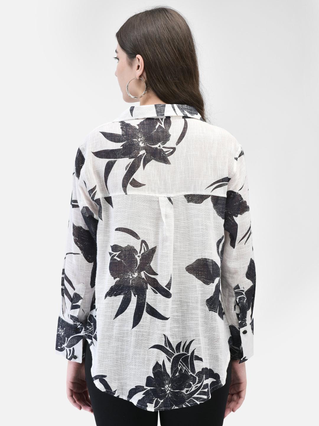 Back view of black and white cotton floral shirt on model
