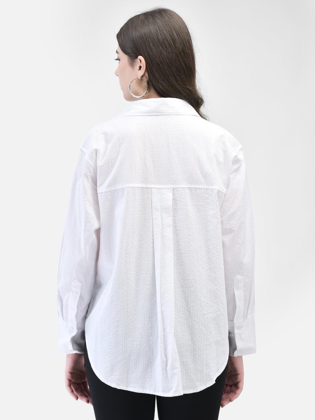 Back view of the Tender Heart Seersucker Shirt with curved hem and textured finish