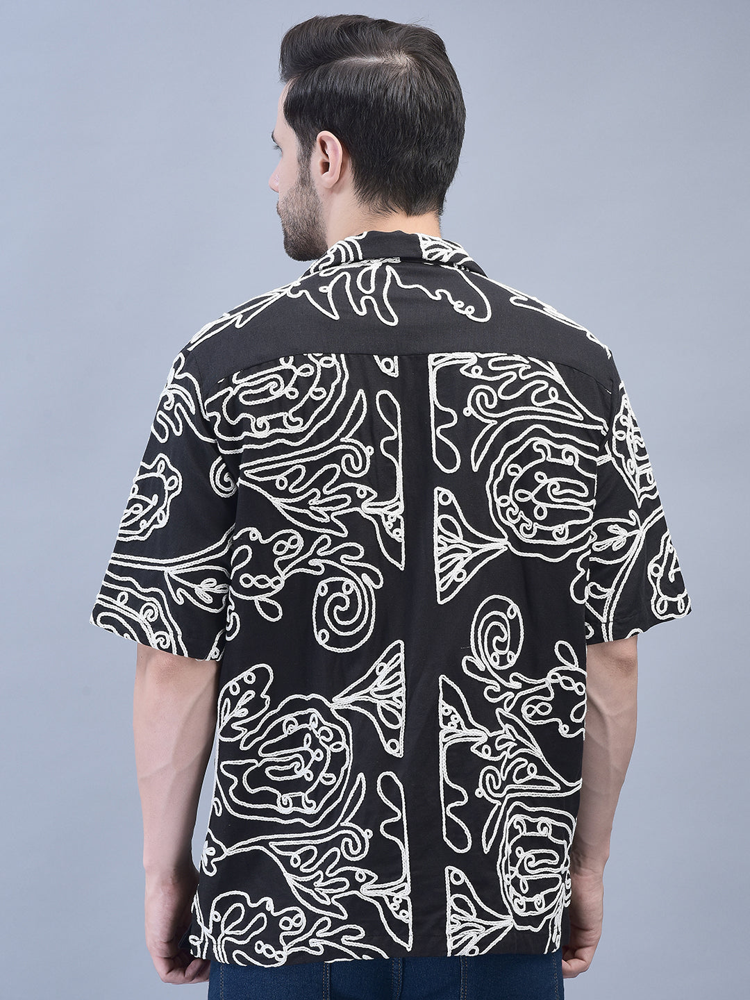 Back view of black embroidered shirt – oversized relaxed fit with visible floral detailing