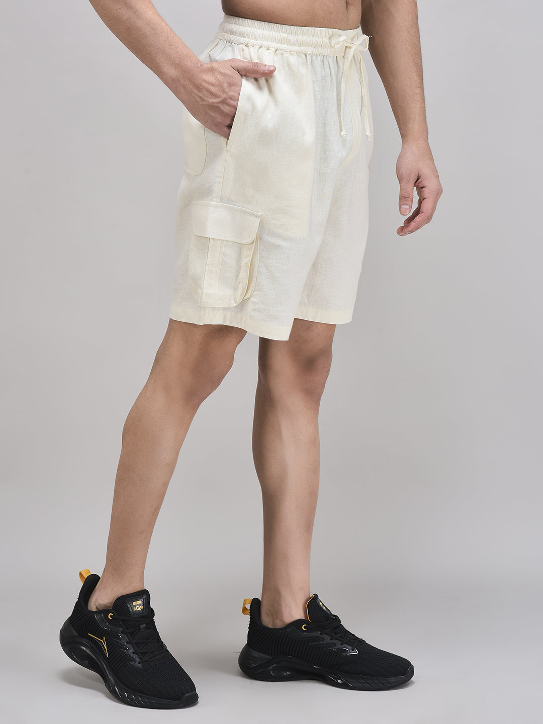 Side view of breathable beige linen shorts