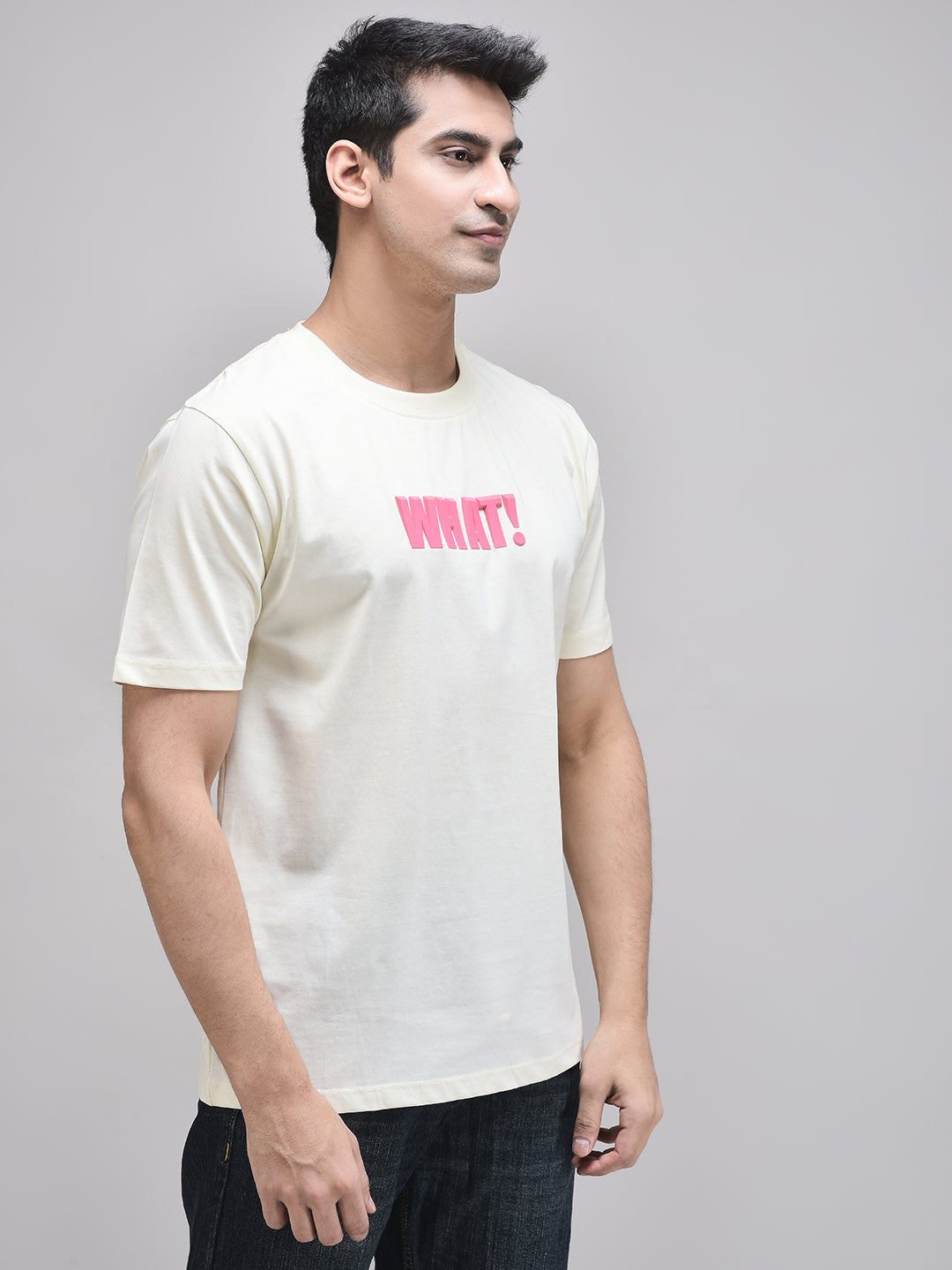 Side view of WHAT! graphic beige t-shirt – relaxed cotton fit