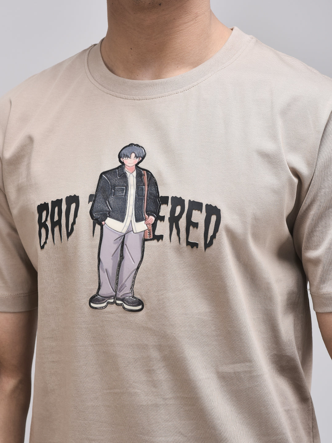 Zoomed-in view of Bad Tempered puff print on brown t-shirt – cotton fabric
