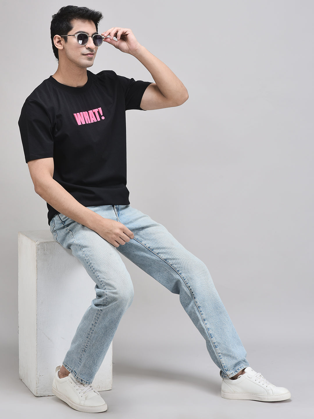 WHAT! graphic black t-shirt styled with blue jeans – casual streetwear look