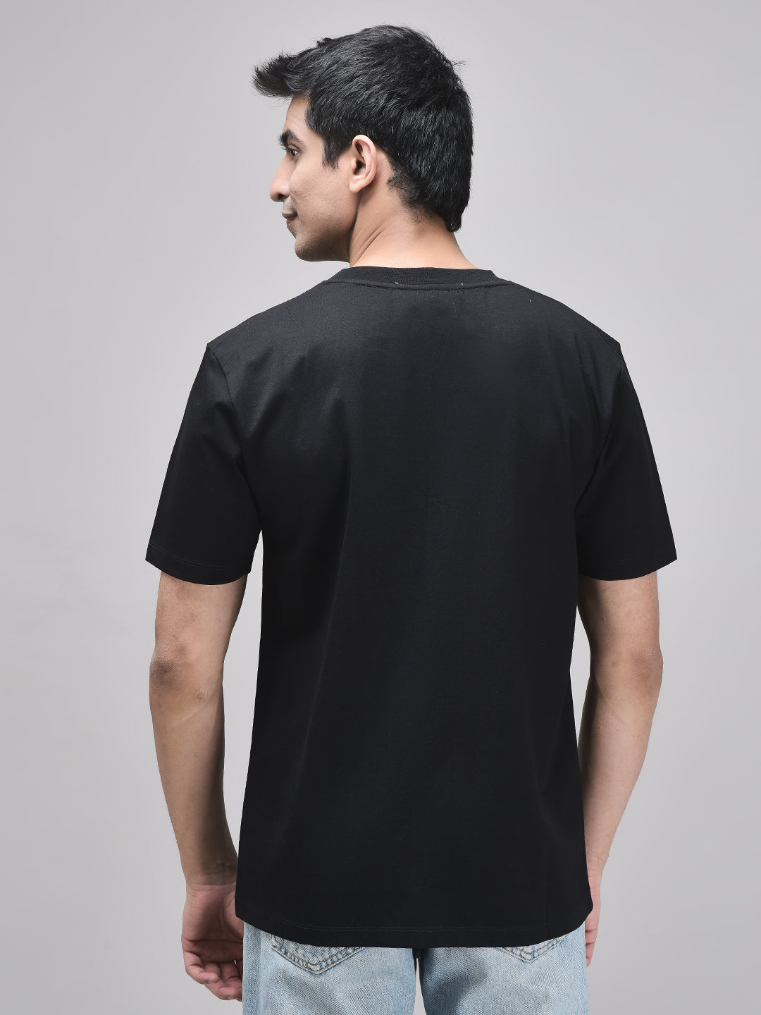Back view of black oversized t-shirt – solid unisex cotton tee