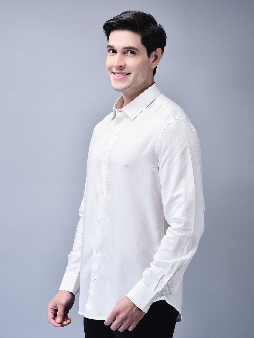 Three-quarter front view – tailored white shirt paired with black trousers
