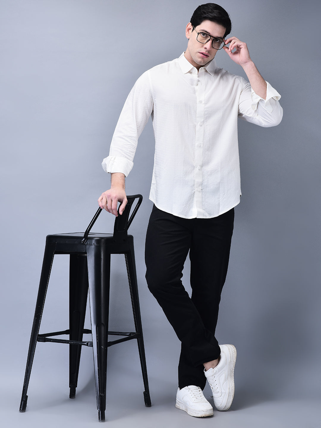 Full body view with model posing near a chair – crisp slim fit white shirt