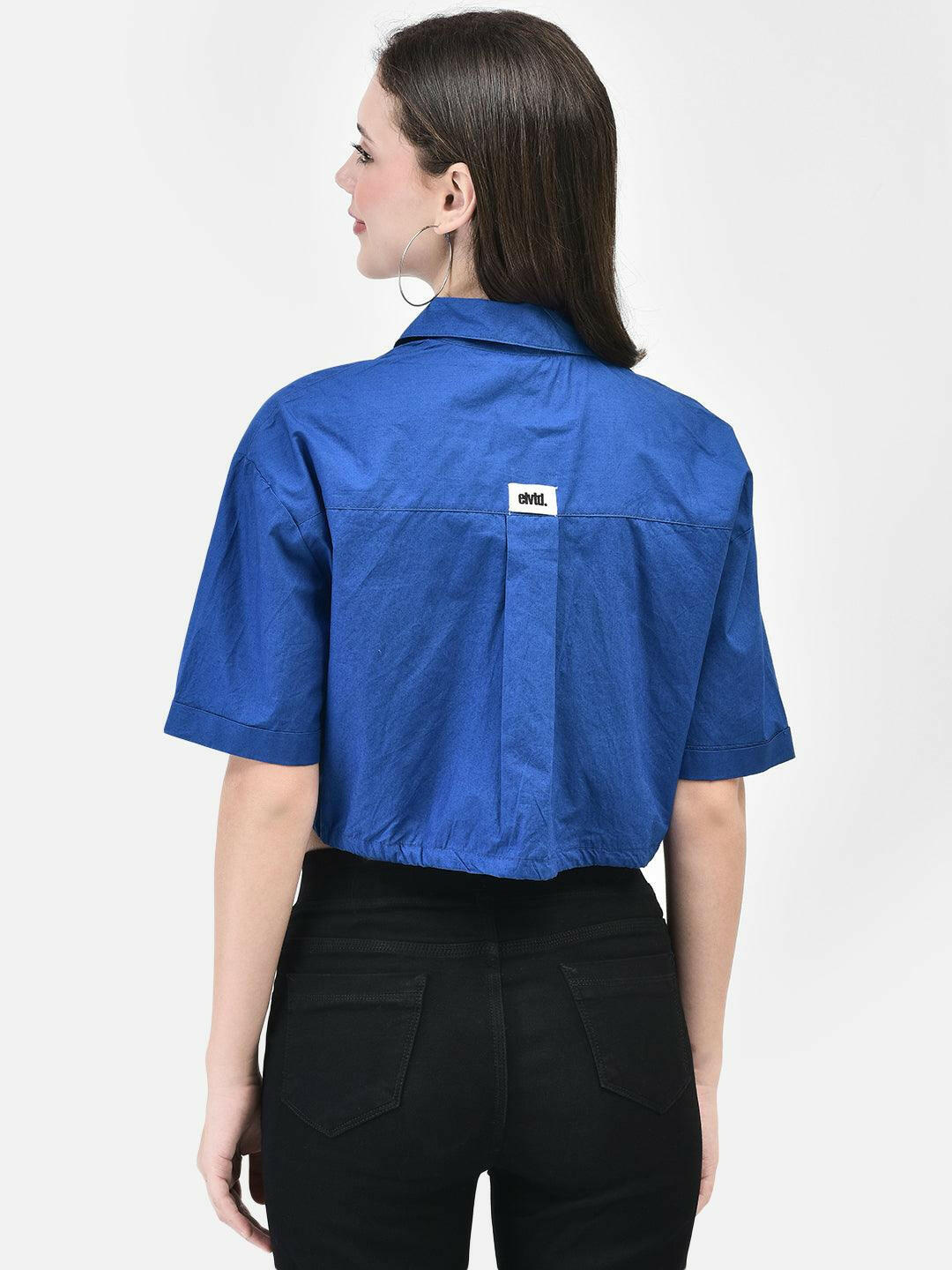 Back view of shirt showcasing cropped length and label