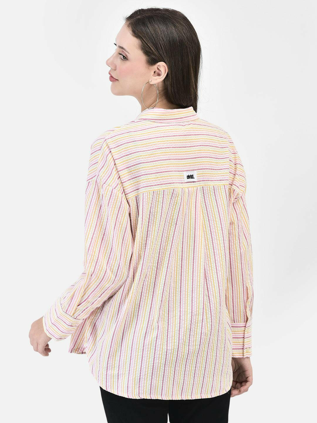 Back view of pink striped cotton shirt – curved hem and loose fit