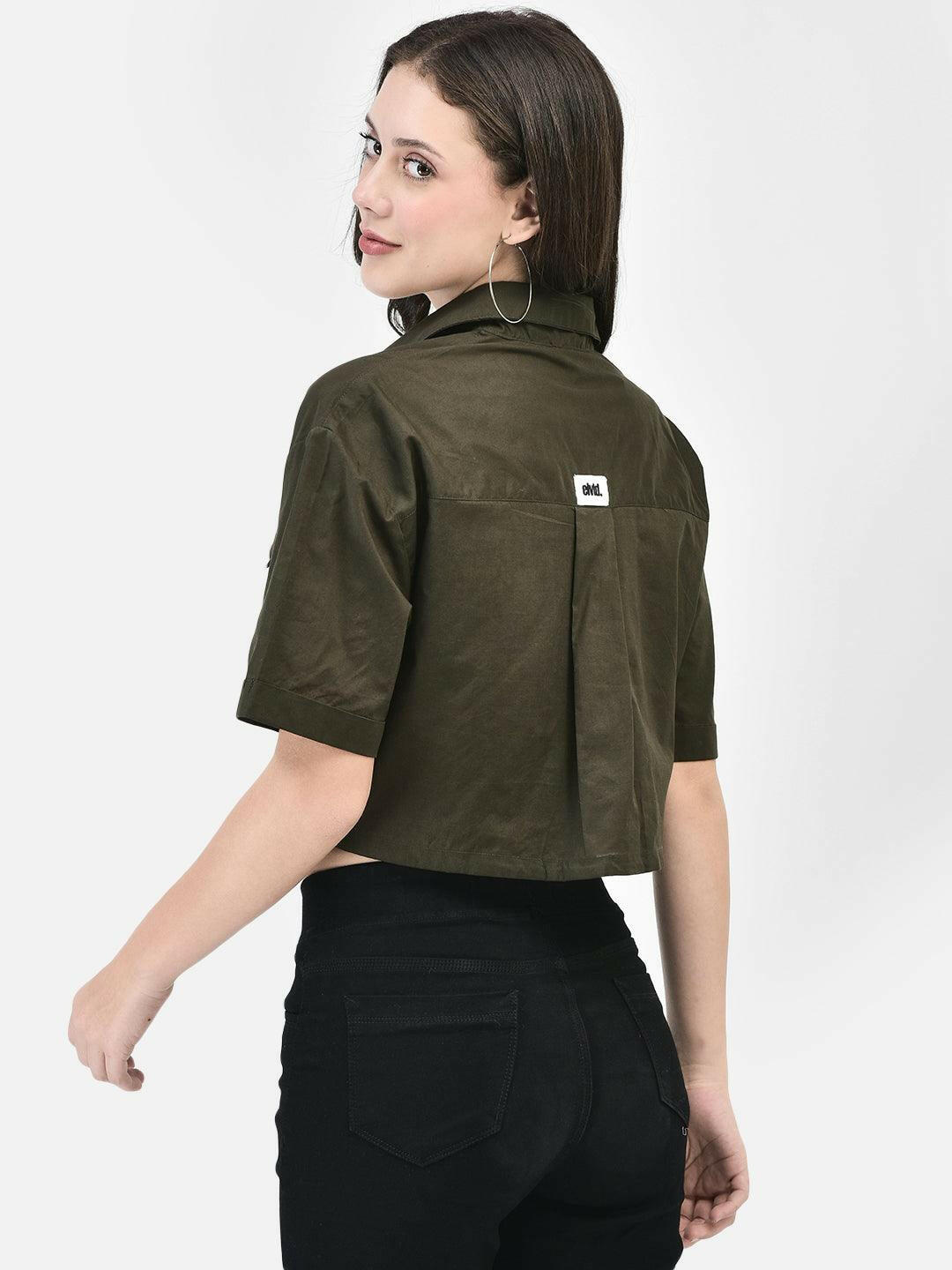 Rear view of olive cropped shirt with minimal design