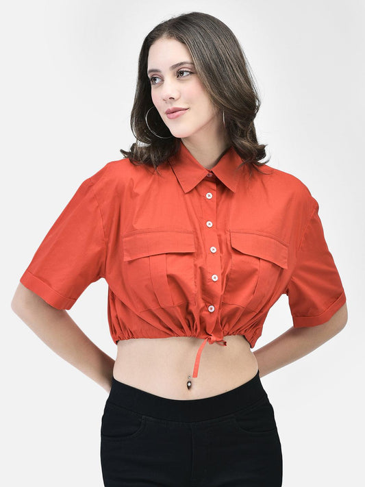Front view of woman wearing crimson cotton crop shirt with dual chest pockets