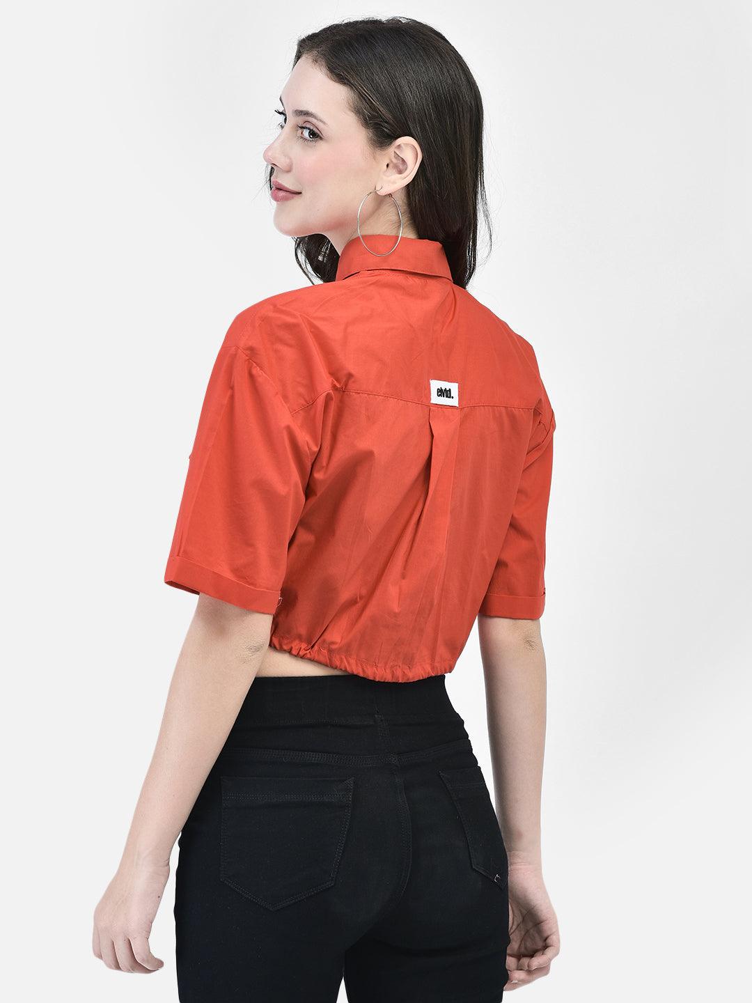 Back view of red cropped summer shirt with short sleeves and yoke detail