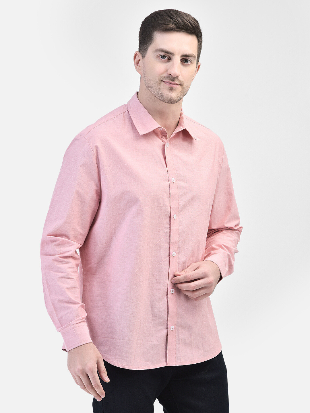 Front-facing pose of men’s full sleeve pink shirt with relaxed posture