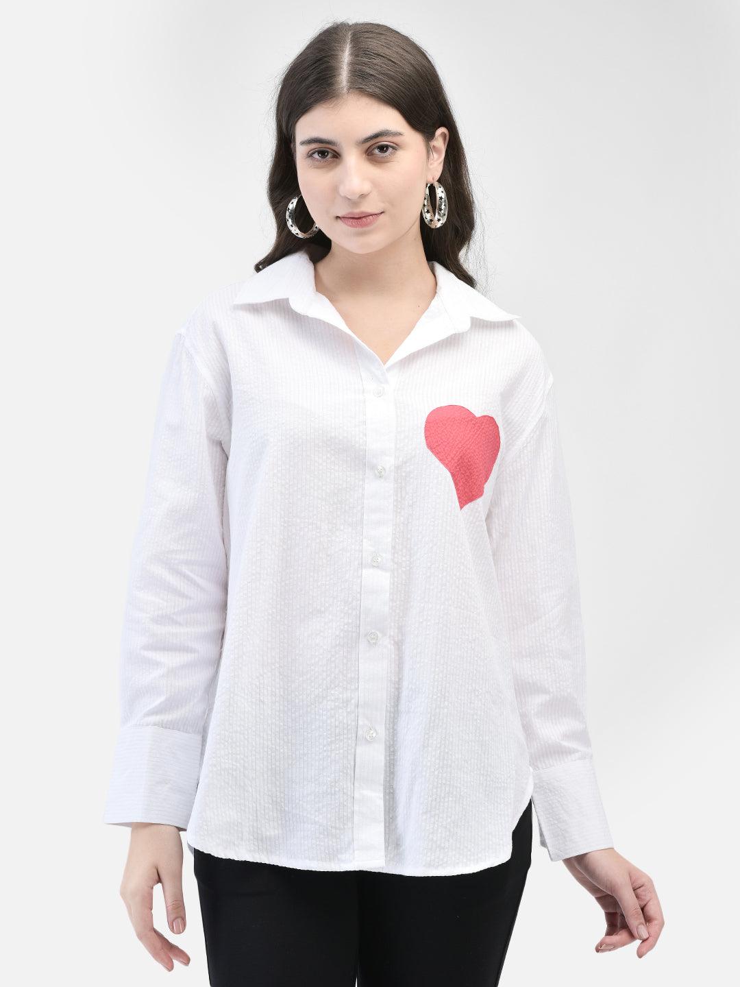 Straight pose showcasing full front of the white seersucker heart shirt