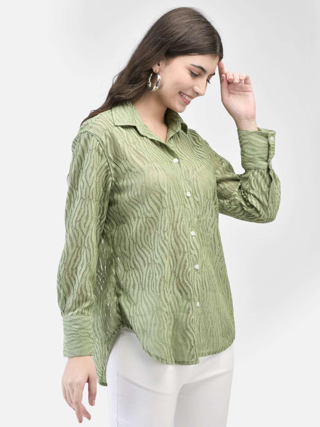Model posing in pistachio green sheer partywear shirt with hand in pocket