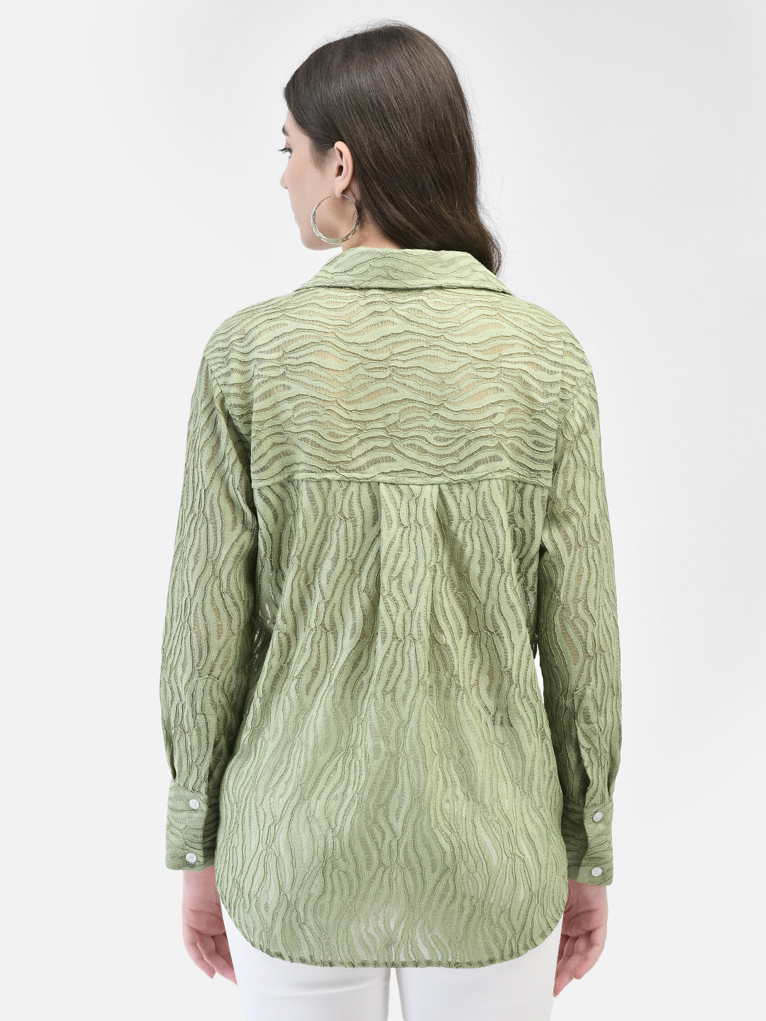 Back view of the pistachio crochet shirt, showing pleats and texture detail