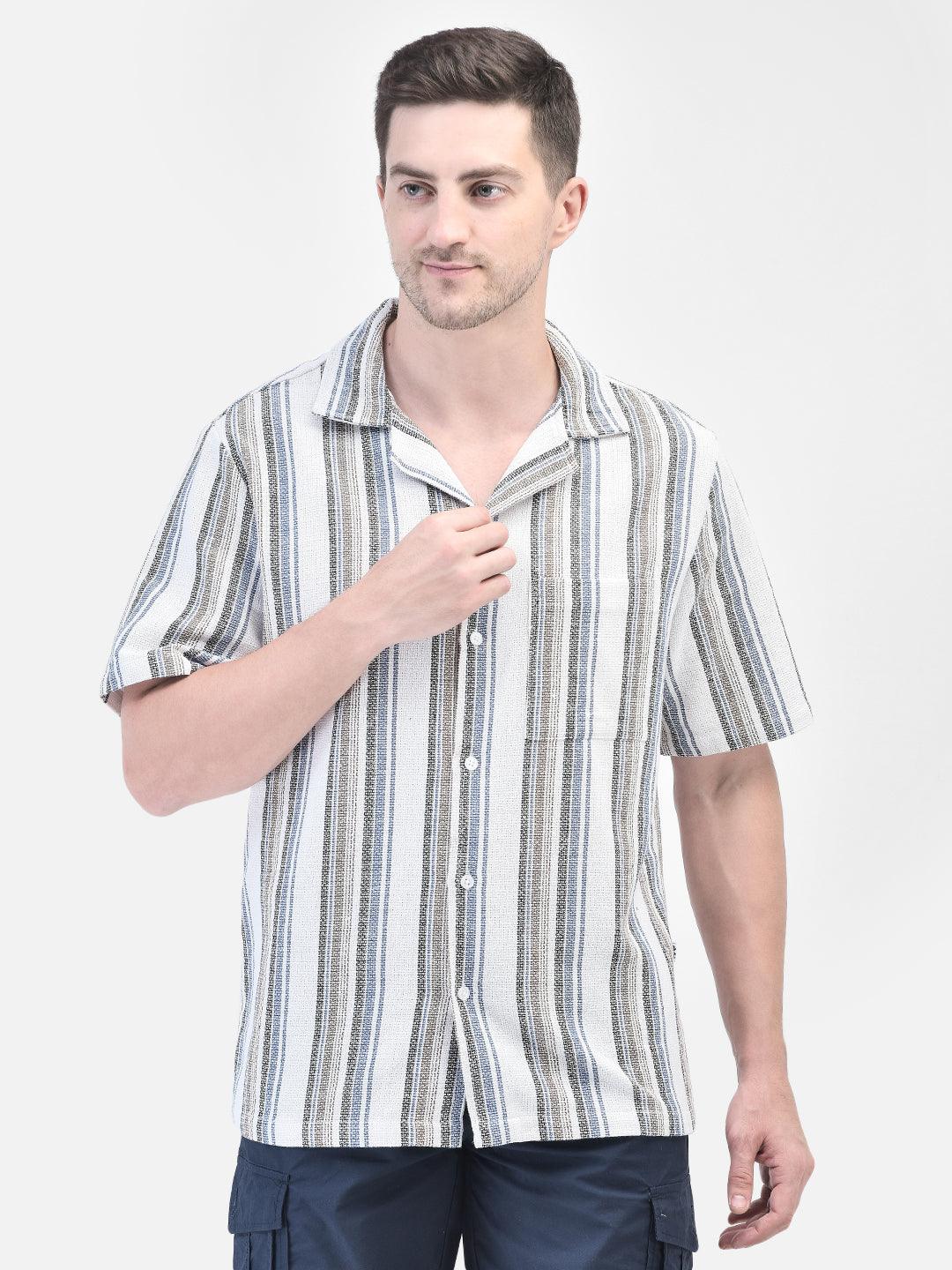 Front view of man in white striped shirt – hands at side, standing straight