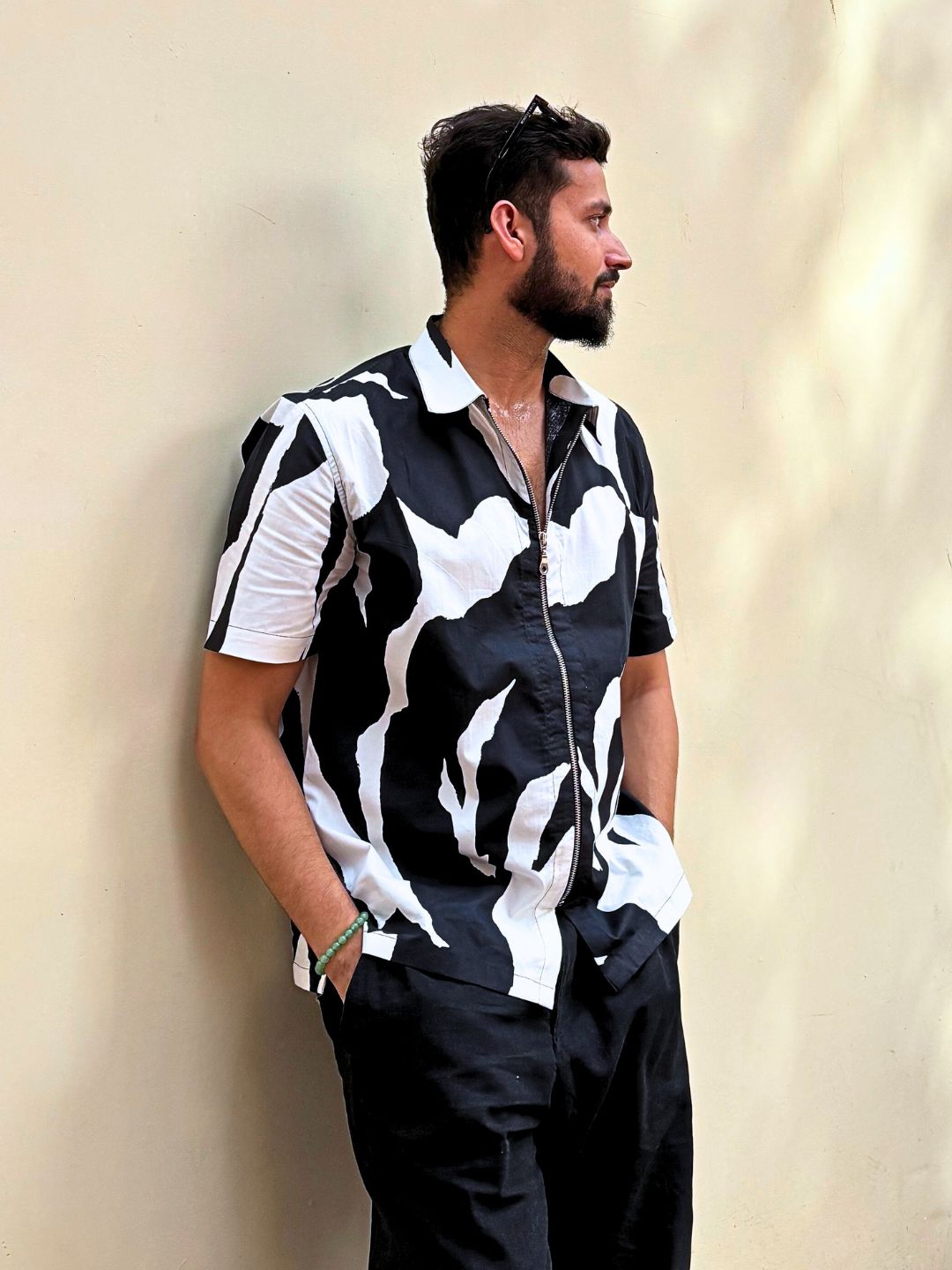 Side view of man in oversized cotton shirt with abstract print – outdoor shoot