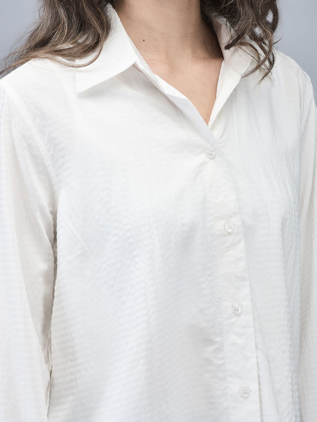 Close-up highlighting the soft spread collar and subtle stripe texture on the shirt.