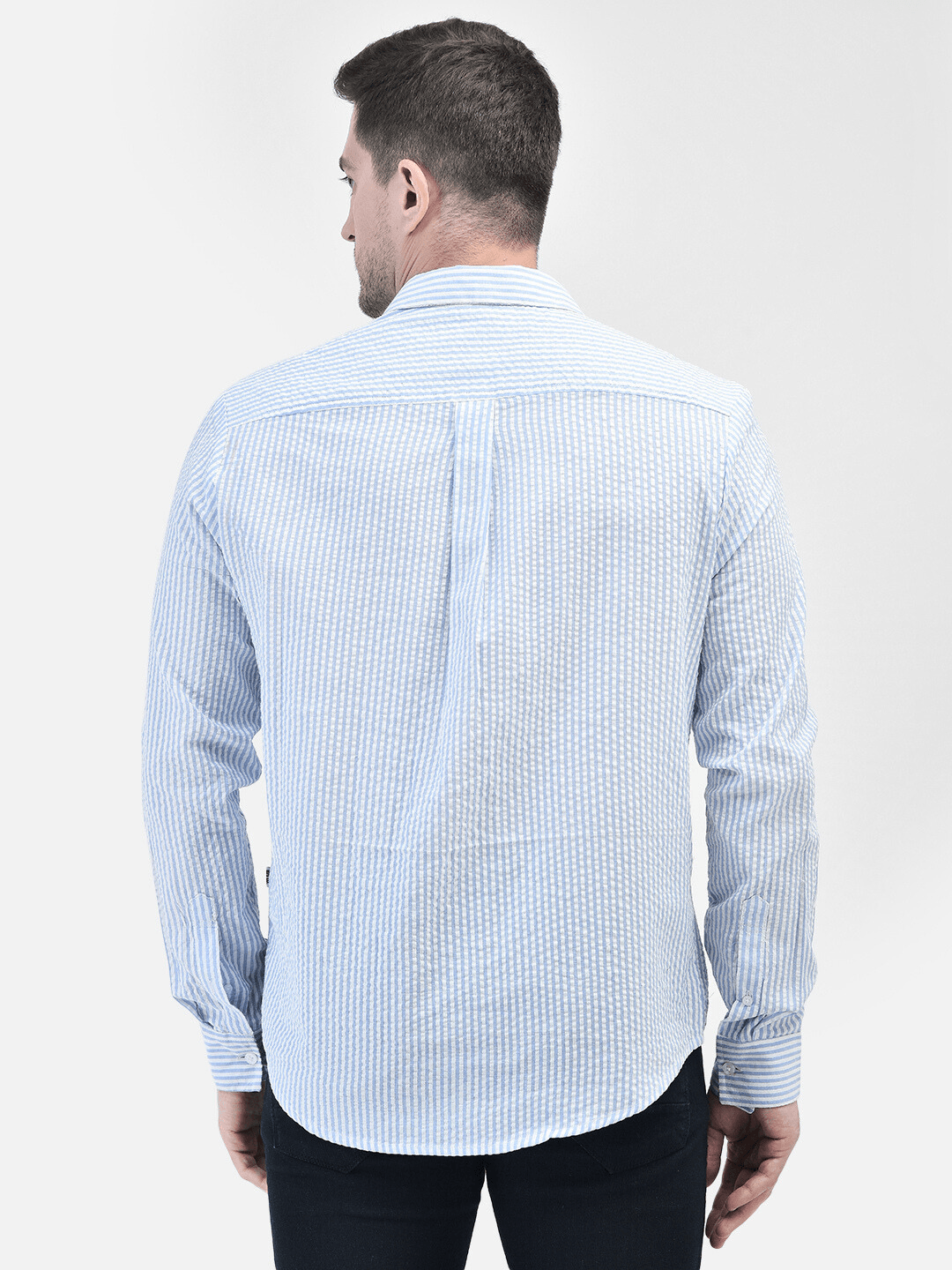 Back view of man wearing blue cotton shirt – casual shirt for summer