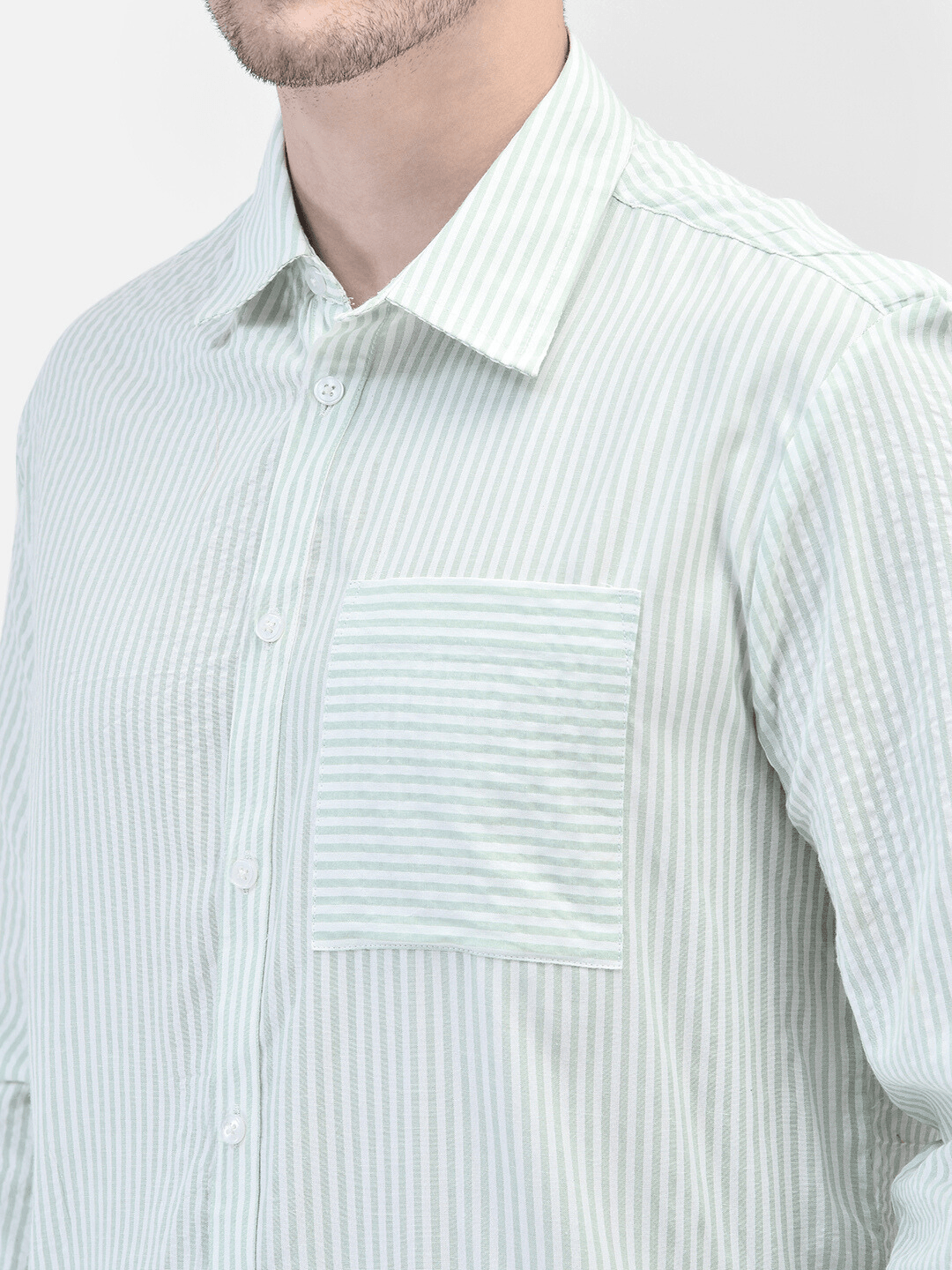 Close-up of shirt collar and front pocket – textured seersucker cotton