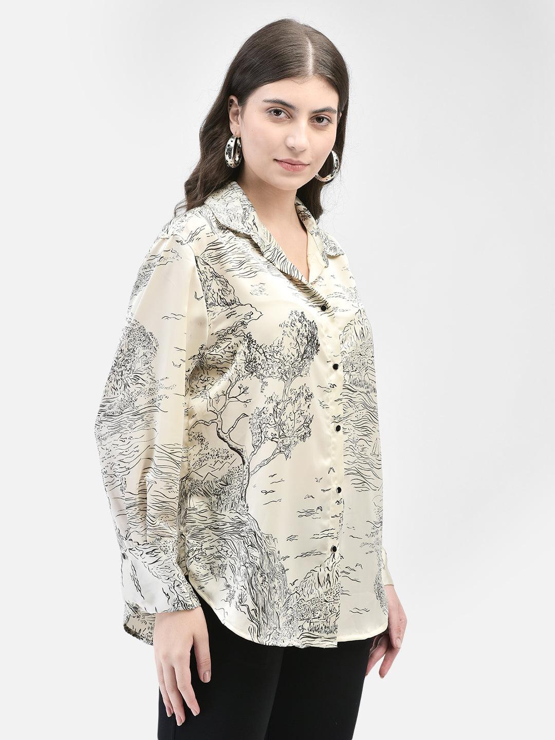 Model wearing relaxed beige printed satin shirt, showing drape and glossy texture