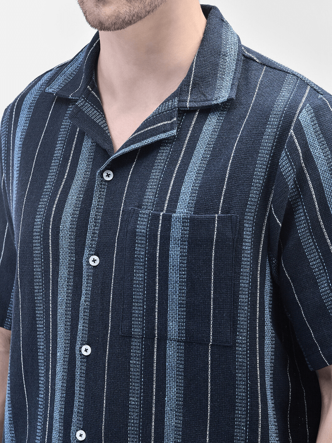 Close-up of collar and fabric texture – navy cotton striped shirt
